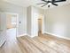 Spacious bedroom with hardwood floors, neutral paint, ceiling fan, and closet at 2210 22Nd Avenue Se Ct, Hickory, NC 28602