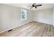 Inviting bedroom highlights wood floors, neutral walls, and a ceiling fan at 2210 22Nd Avenue Se Ct, Hickory, NC 28602