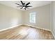 Cozy bedroom offering hardwood floors, a ceiling fan, and natural light at 2210 22Nd Avenue Se Ct, Hickory, NC 28602