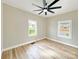 Relaxing bedroom featuring hardwood floors, a neutral paint scheme, and modern ceiling fan at 2210 22Nd Avenue Se Ct, Hickory, NC 28602
