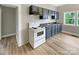 Functional kitchen boasts updated cabinets, modern appliances, and durable wood flooring at 2210 22Nd Avenue Se Ct, Hickory, NC 28602