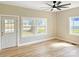 Bright living room featuring hardwood floors, neutral paint, and a modern ceiling fan at 2210 22Nd Avenue Se Ct, Hickory, NC 28602