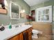 Bathroom with earthy tones, a window, a shower with curtain, and a stylish vanity at 2248 Lawton Bluff Rd, Charlotte, NC 28226