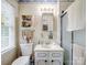 Traditional bathroom featuring a white vanity and medicine cabinet providing storage for toiletries at 2248 Lawton Bluff Rd, Charlotte, NC 28226