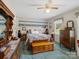 Comfortable bedroom featuring a unique décor, a ceiling fan, and ample storage for personal belongings at 2248 Lawton Bluff Rd, Charlotte, NC 28226