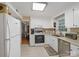 Functional kitchen with white cabinetry, modern appliances, and plenty of countertop space, ideal for cooking at 2248 Lawton Bluff Rd, Charlotte, NC 28226