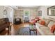 Inviting living room with built-in shelves, hardwood floors, and comfortable seating, great for relaxing at 2248 Lawton Bluff Rd, Charlotte, NC 28226