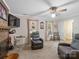 Cozy living room with a brick fireplace, ceiling fan, and plush seating, perfect for relaxation at 2248 Lawton Bluff Rd, Charlotte, NC 28226