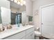 Bathroom features a double sink vanity, modern fixtures, and a decorative mirror at 2402 Winfield St, Kannapolis, NC 28083
