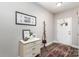 Inviting foyer with a decorative chest, coat rack, and a patterned rug on wood-look flooring, creating a warm entry at 2402 Winfield St, Kannapolis, NC 28083