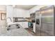 Modern kitchen with white cabinets, stainless steel appliances, and granite countertops at 2402 Winfield St, Kannapolis, NC 28083