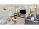 Bright living room features hardwood floors and plenty of natural light from the large windows at 2402 Winfield St, Kannapolis, NC 28083