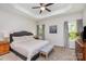 Spacious main bedroom with tray ceiling, ceiling fan, and large windows for natural lighting at 2402 Winfield St, Kannapolis, NC 28083