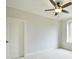 Neutral bedroom features a ceiling fan, and is painted in a soft white color at 2415 Christenbury Hall Nw Dr, Concord, NC 28027