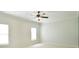Bright bedroom with a ceiling fan and large windows for natural light at 2415 Christenbury Hall Nw Dr, Concord, NC 28027