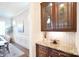 Butler's pantry with custom wood cabinets, granite countertops, and elegant backsplash at 2415 Christenbury Hall Nw Dr, Concord, NC 28027