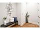 Inviting entryway featuring hardwood floors, bench seating, and stylish decor at 2415 Christenbury Hall Nw Dr, Concord, NC 28027