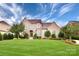 Charming two-story home boasts a stone facade and manicured lawn, creating a welcoming curb appeal at 2415 Christenbury Hall Nw Dr, Concord, NC 28027