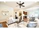 Open-concept living room provides access to the kitchen and breakfast nook; features neutral decor at 2415 Christenbury Hall Nw Dr, Concord, NC 28027