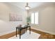 Cozy office featuring hardwood floors and plantation shutters at 2415 Christenbury Hall Nw Dr, Concord, NC 28027