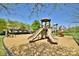 Community playground with slides, swings, and picnic area on a wood chip safety surface at 2415 Christenbury Hall Nw Dr, Concord, NC 28027