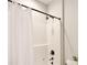 Shower stall featuring a white shower curtain and updated dark bronze hardware at 2415 Christenbury Hall Nw Dr, Concord, NC 28027