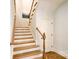 Classic staircase with wooden steps, white risers, and decorative railing, leading to the next level at 2415 Christenbury Hall Nw Dr, Concord, NC 28027