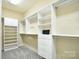 Spacious walk-in closet with built-in shelving, drawers, and ample storage space at 2415 Christenbury Hall Nw Dr, Concord, NC 28027