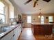 Bright kitchen with wooden floors, stainless steel appliances, island with counter seating and double sinks at 24436 Nc 24/27 Hwy, Albemarle, NC 28001