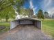 Carport-style metal shed with a gravel base, offering storage and functionality at 24436 Nc 24/27 Hwy, Albemarle, NC 28001