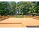 Large wooden deck with railing overlooking the expansive backyard and tree line at 255 Honeysuckle Creek Loop, Mooresville, NC 28117