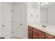 Bathroom featuring a single vanity with a large mirror at 255 Honeysuckle Creek Loop, Mooresville, NC 28117
