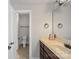 Bathroom with a single vanity and toilet in a separate room at 255 Honeysuckle Creek Loop, Mooresville, NC 28117