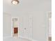 A bedroom featuring two white doors, one leading to the bathroom at 255 Honeysuckle Creek Loop, Mooresville, NC 28117