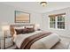 Bedroom featuring large bed, two side tables and nature-inspired art on the wall at 255 Honeysuckle Creek Loop, Mooresville, NC 28117