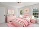 A bedroom featuring a pink bedroom set and decor at 255 Honeysuckle Creek Loop, Mooresville, NC 28117