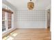 Versatile room with hardwood floors, wainscoting, and a large window with views at 255 Honeysuckle Creek Loop, Mooresville, NC 28117