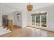 Bright foyer with hardwood floors, a staircase, and a large window with natural light at 255 Honeysuckle Creek Loop, Mooresville, NC 28117