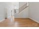 Spacious foyer with hardwood floors, staircase, and an abundance of natural light at 255 Honeysuckle Creek Loop, Mooresville, NC 28117