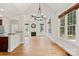 Bright living room with hardwood floors, fireplace, and large windows offering plenty of natural light at 255 Honeysuckle Creek Loop, Mooresville, NC 28117