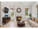 Comfortable living room with hardwood floors, a fireplace, and comfortable seating at 255 Honeysuckle Creek Loop, Mooresville, NC 28117