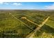 An aerial view showing the property lines of a wooded lot with a house nestled within at 2710 Wyatt Grove Church Rd, Richfield, NC 28137