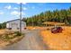 Exterior view of the garage and a red Jeep with a covered pergola at 2710 Wyatt Grove Church Rd, Richfield, NC 28137
