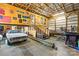 Large garage with wood walls, stairs, a vintage car, and ample storage at 2710 Wyatt Grove Church Rd, Richfield, NC 28137
