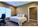Cozy bedroom with a queen bed, natural light, and comfortable carpeting at 28926 Hartsell Rd, Albemarle, NC 28001