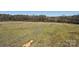 Open land featuring gentle rolling hills with trees in the distance under a clear sky at 28926 Hartsell Rd, Albemarle, NC 28001