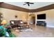 Spacious living room featuring hardwood floors and a tray ceiling with a western decor at 28926 Hartsell Rd, Albemarle, NC 28001