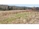 This property features a partially grassed lot amid a quiet wooded and rural environment at 28926 Hartsell Rd, Albemarle, NC 28001