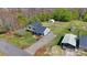 Aerial view of home, expansive driveway, two outbuildings and a lush, green lawn at 2948 Christy Leigh Dr, Newton, NC 28658