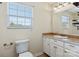 Well-lit bathroom featuring tile flooring, vanity with drawers, and large mirror at 2948 Christy Leigh Dr, Newton, NC 28658